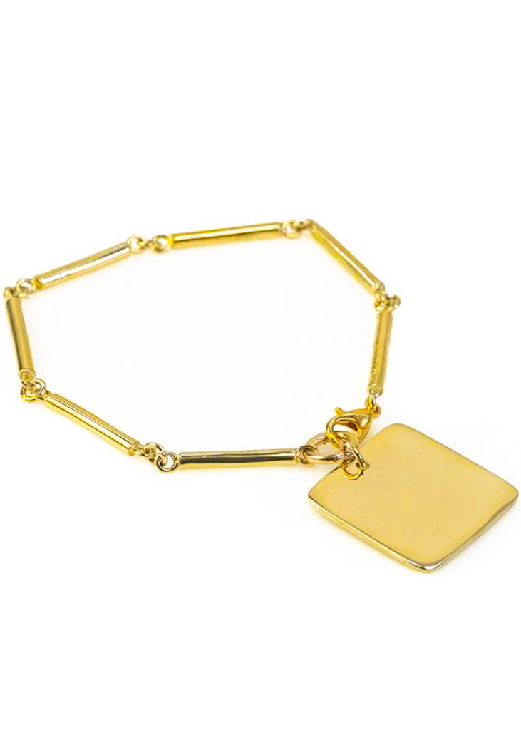 Audacity. Gold, rod-chain bracelet, with a gold, square plaque. Designed by 3rd Floor