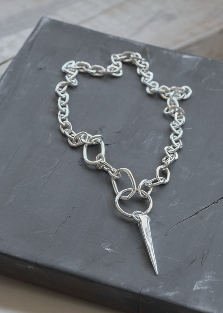 Echo. Silver, cable link chain necklace, with a round link, and square spike element. By 3rd Floor Jewellery