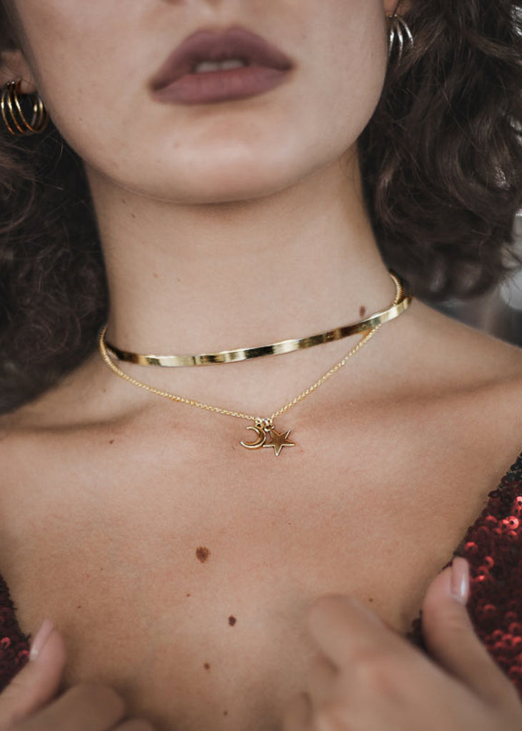 woman with night Sky. Handmade, gold plated sterling silver, choker-chain necklace, adorned with a dangling half moon, and star