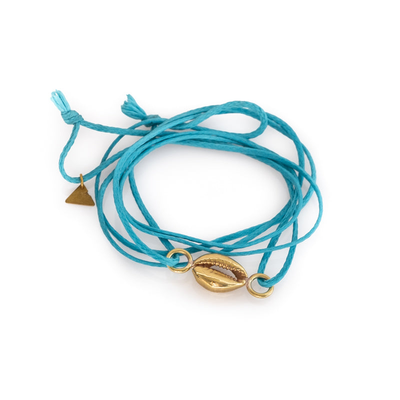 Turquoise colored, double, cord bracelet with a center, gold colored seashell