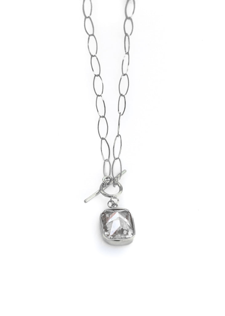 Silver, oval loop, chain necklace, with a white colored, emerald cut, zirgon stone