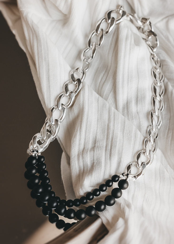 chain necklace, with a double strand of matte, black onyx stones