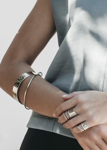 close up woman, wearing silver bracelet, cuff,