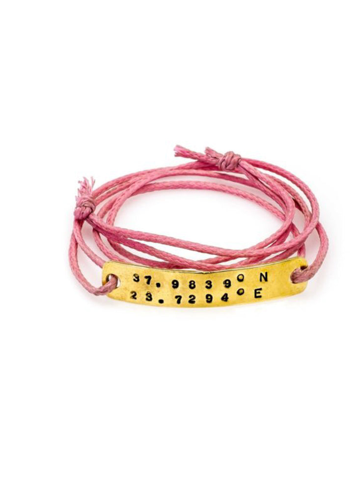 Atlantis gold plated plaque pink wax cord wristlet stamped with latitude and longitude coordinates by 3rd Floor Handmade Jewellery