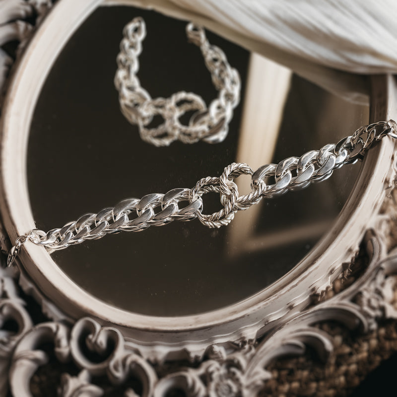 Silver, curb link chain necklace, with a central, interlocking, rope chain 