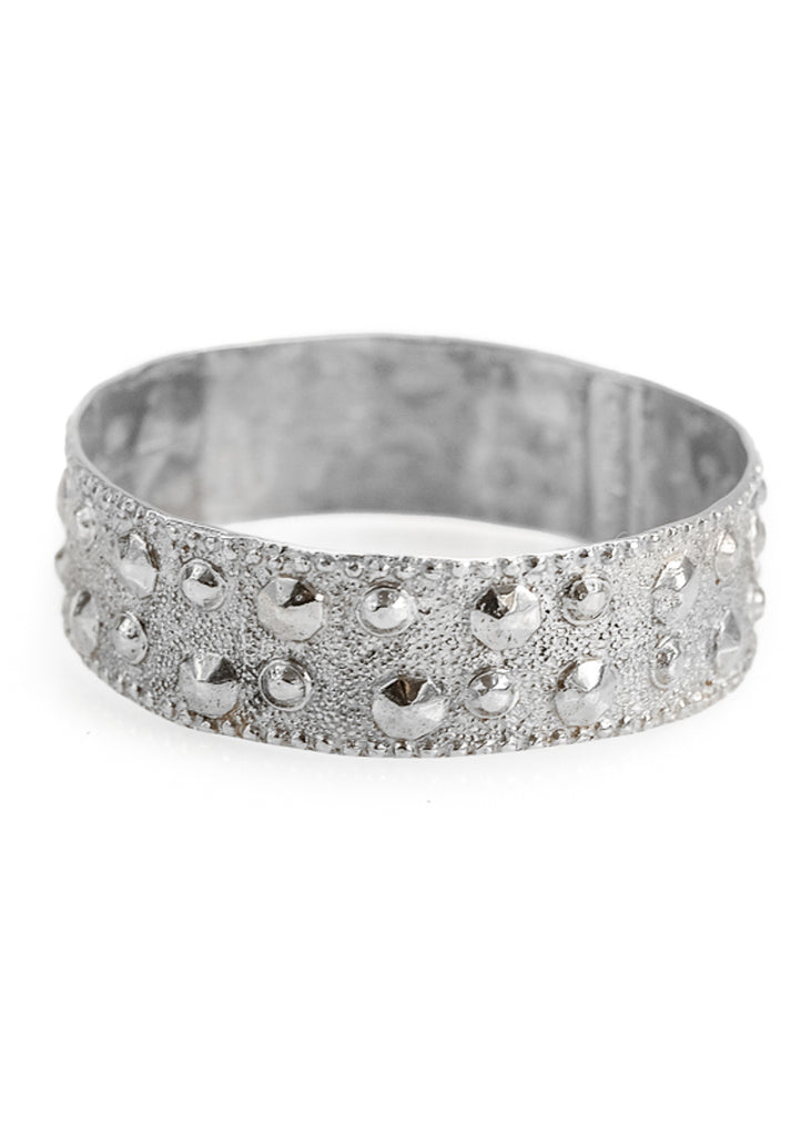 Elizabeth. Silver, wide, bangle bracelet, with protruding, spike-like dots. By 3rd Floor Handmade Jewellery 