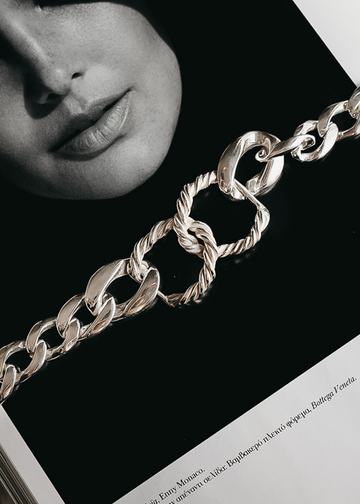 Two interlocked, rope chain link bracelet, with curb link chains on either side.