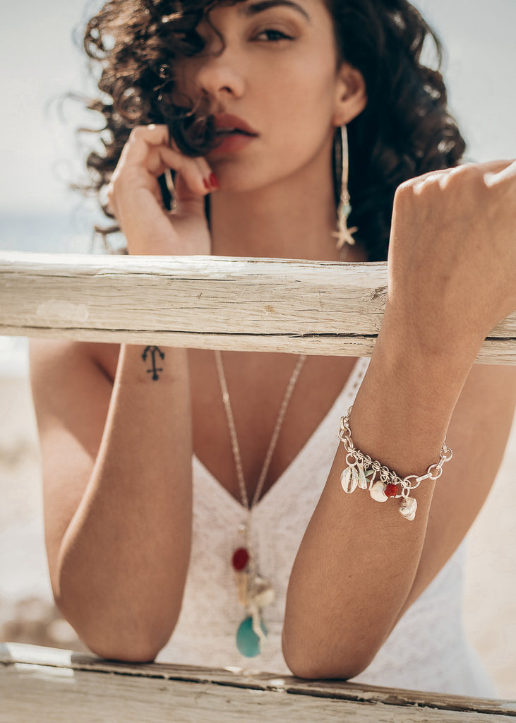 woman on the beach, wearing June bracelet silver