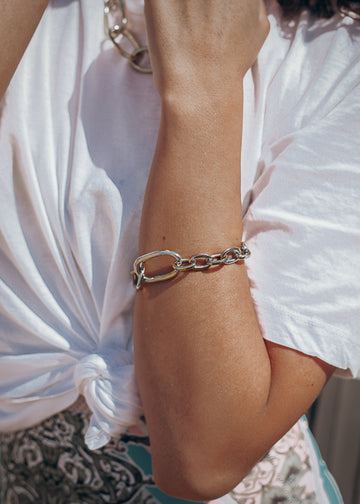 girl with white shirt,  wearing  handmade bracelet massive,silver