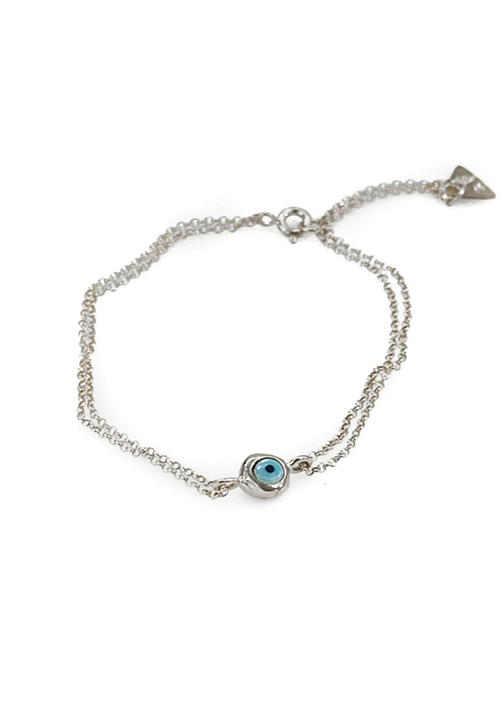 Mataki. Double chain bracelet, with a small, encased evil eye, in the middle.