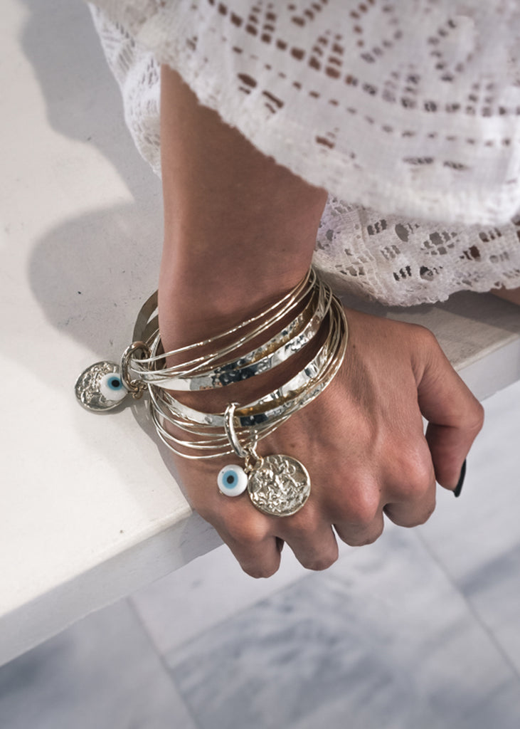 Handmade Thállō bracelet, consisting of 7, uneven in size separate bracelets 