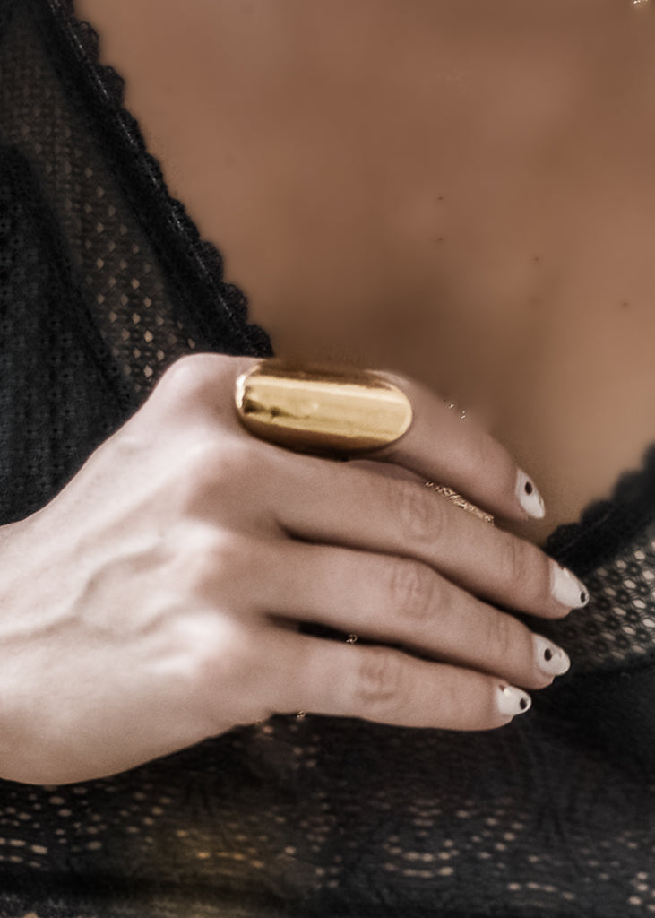 woman with Cliff ring. Handmade, gold plated silver ring