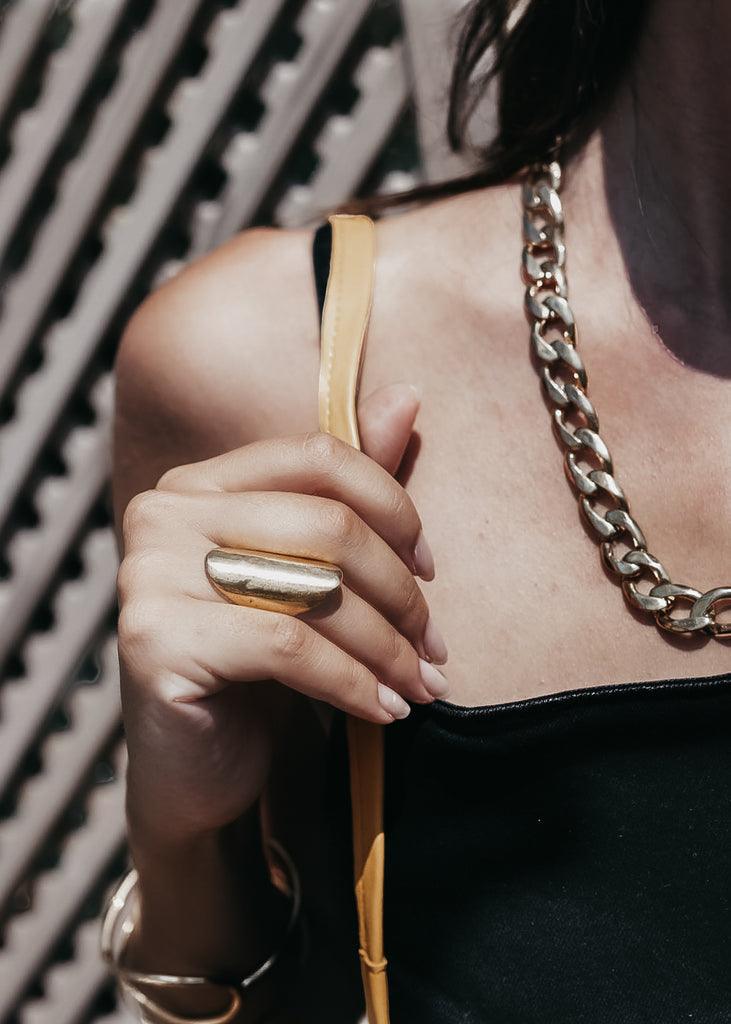 woman with black top wearing Cliff ring. Handmade, gold plated silver ring, created in Athens by 3rd Floor Workshop