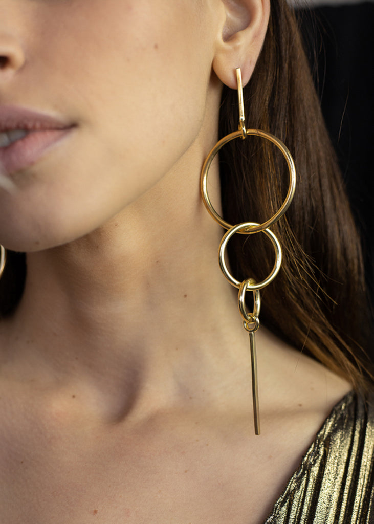 woman close-up wearing,Gold, pendant, link earrings 