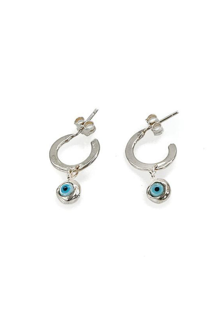 Mataki. Photo of a silver pair of loop earrings with a small hanging evil eye