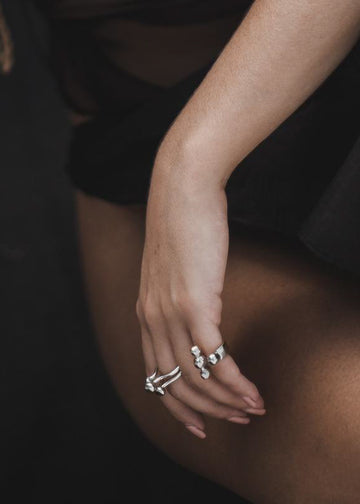 woman in black, wearing 3rd floor handmade Elan ring silver