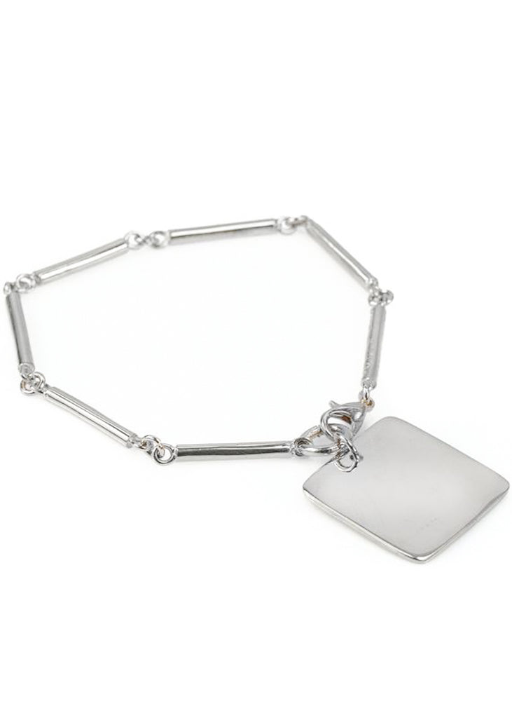 Audacity. Silver, rod-chain bracelet, with a gold, square plaque. Designed by 3rd Floor