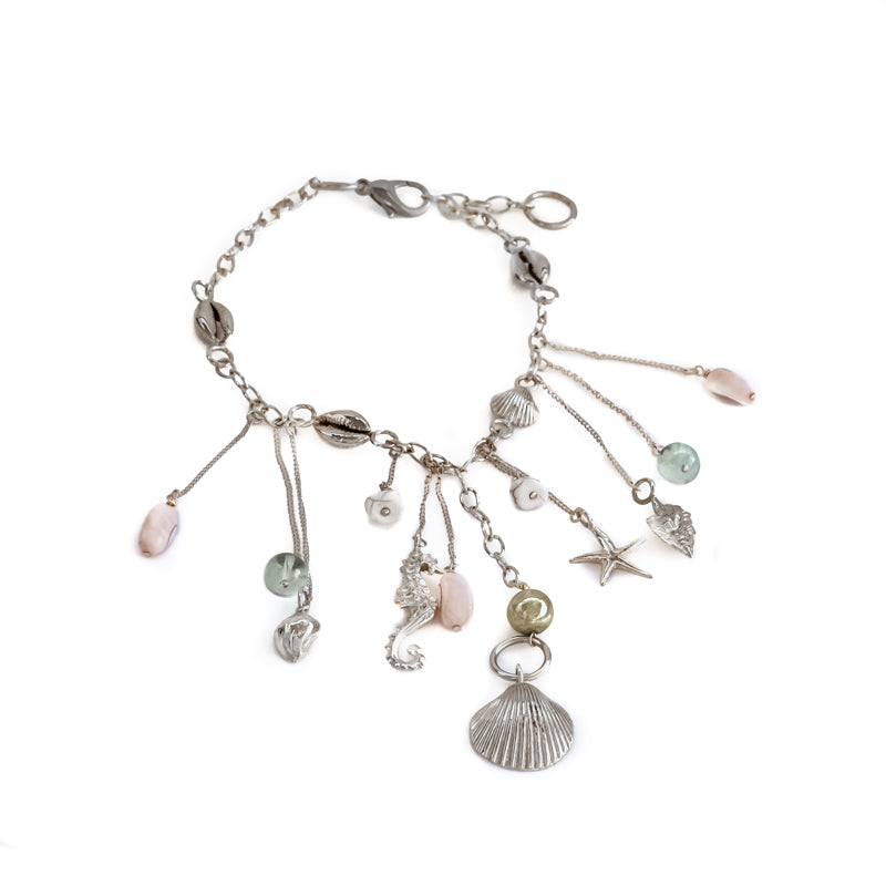 Bailar. Silver charm necklace, with summer charms, and colorful stones. By 3rd Floor Lab