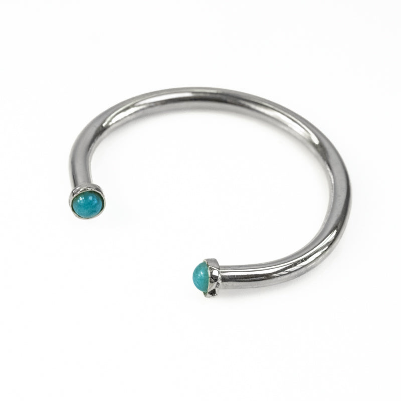 Cosette. Silver, adjustable bracelet, with an encased, turquoise stone, on either end