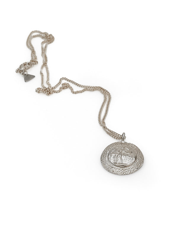 Knossos. Handmade, silver plated brass, pendant festooned with the Prince of Lillies. By 3rd Floor Hamdade Jewellery