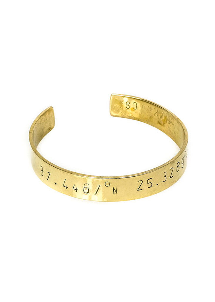 handmade gold plated adjustable bangle stamped with latitude and longitude coordinates
