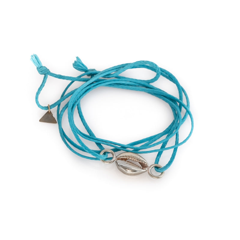 Turquoise colored, double, cord bracelet with a center, silver colored seashell