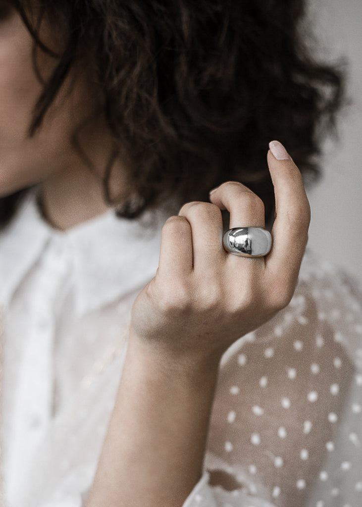 woman in white shirt,wearing a Handmade melrose Ring 925 silver by 3rd floor jewels lab