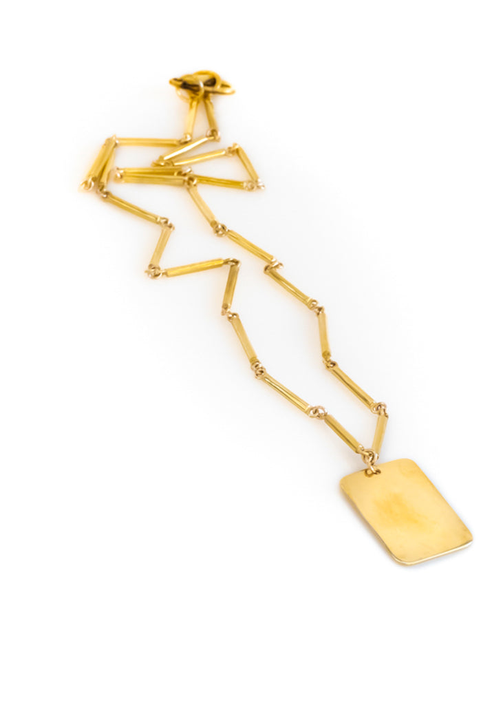Audacity. Gold, rod-chain necklace, with a gold, square plaque. Designed by 3rd Floor