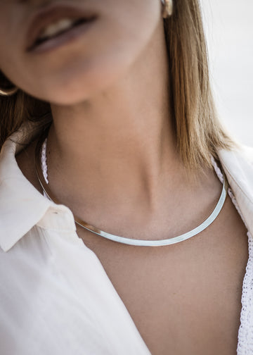 girl in white, wearing, handmade plain necklace