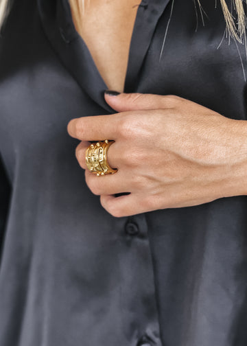 girl with gray dress wearing 3rd floor handmade Dubai ring gold 