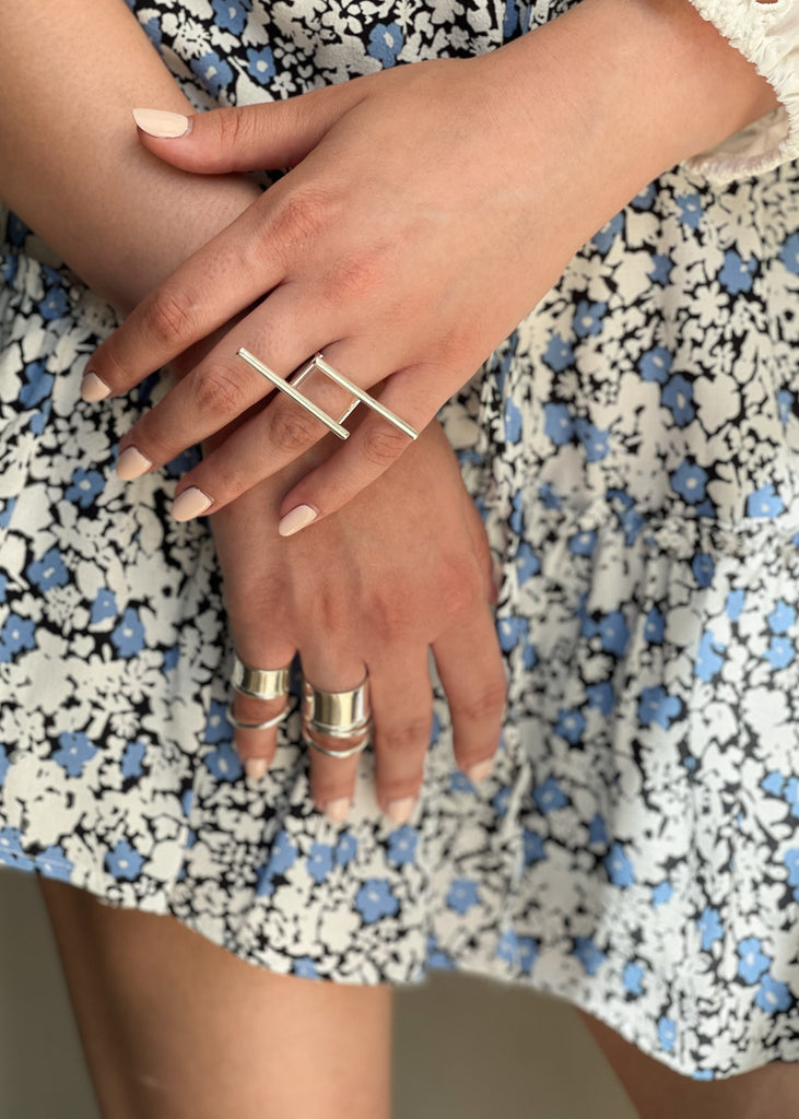  female hand, with nude manicure, wearing an art statement ring by 3rd Floor Handmade Jewellery