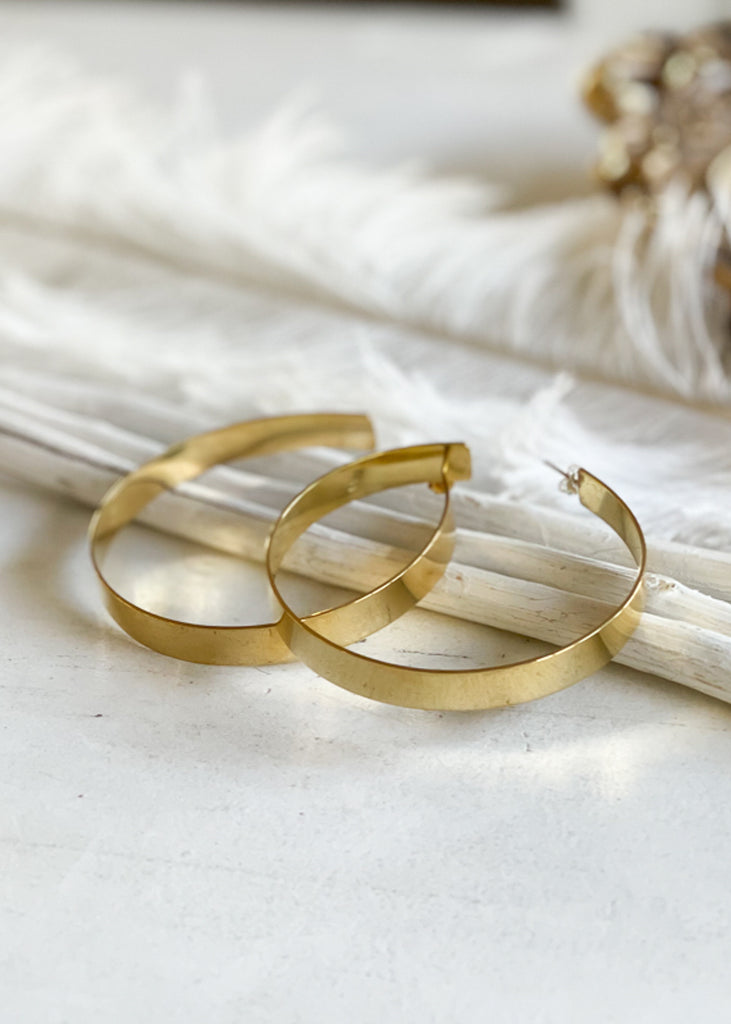  pair of gold, wide, loop earrings