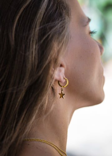 Handmade, gold plated silver, loop earrings with a small dangling star. Designed by 3rd Floor Lab