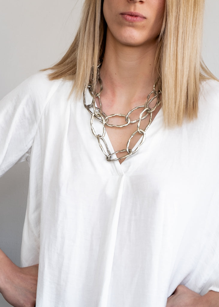 girl in white shirt with  handmade necklace necklace noor silver