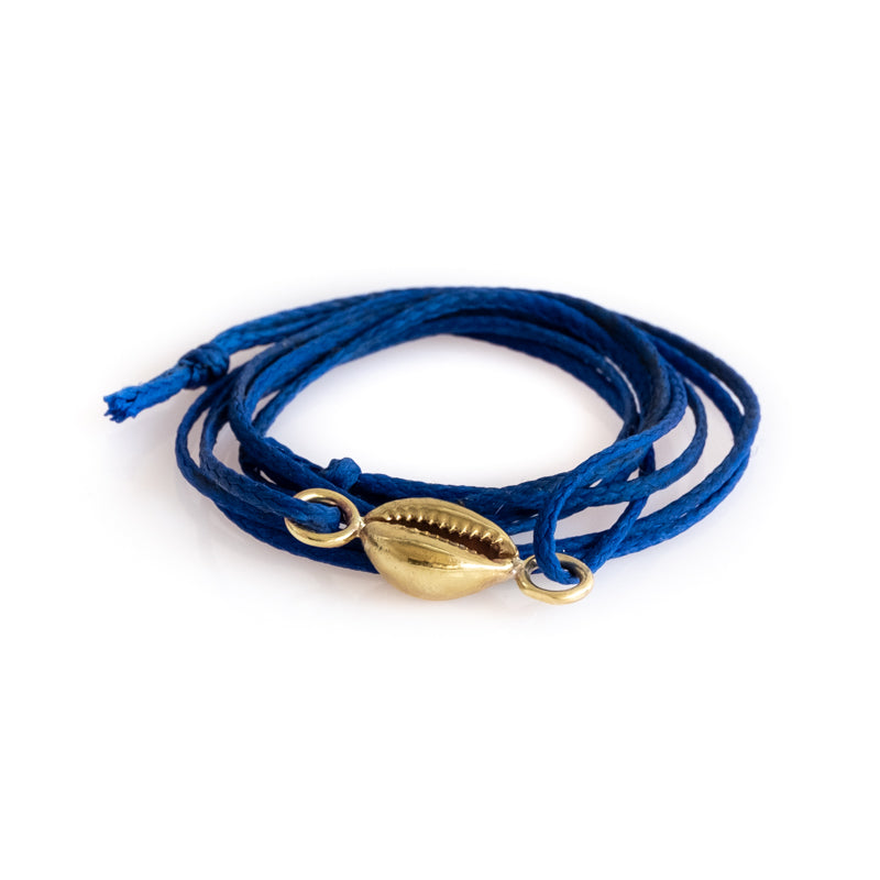 Cobalt blue, double, cord bracelet with a center, gold colored seashell