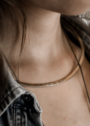 girl in jeans, wearing a flat, gold plated, collar neckpiece by 3rd Floor Coordinates Collection