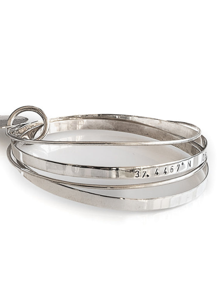 Journey silver handmade bracelet stamped with the longitude and latitude coordinates of your choice by 3rd Floor Coordinates Line